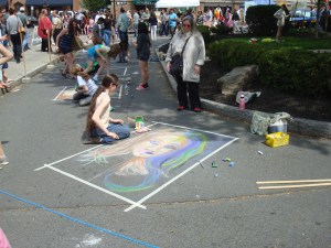 Artists work with chalk on the street at Communiversity 2013