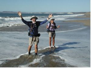 Ken and Marcia Powers celebrate in the breakers of the Pacific Ocean after walking the length of the American Discovery Trail. 