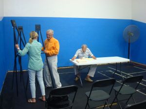 Robert and Barbara Hillier set up their presentation at the Princeton YMCA July 27, as Chair Jim Floyd looks on. (Click to expand.)