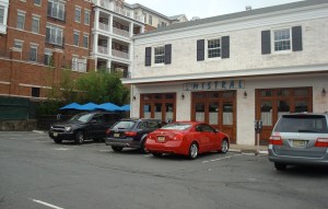 Mistral restaurant in downtown Princeton: a surface parking lot out front, diners squeezed in around the back. (Click to expand.)