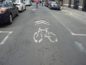 An example of 'shared lane markings' or 'sharrows'. (click to expand)